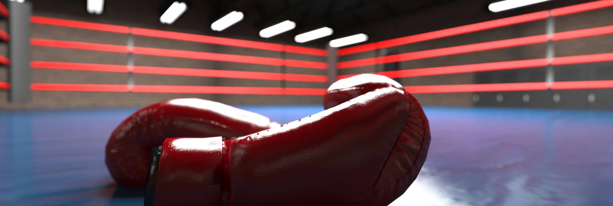 Boxing gloves lie on a boxing ring floor