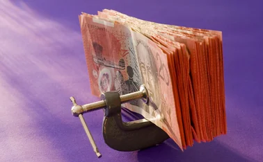 Australian dollars in a vice