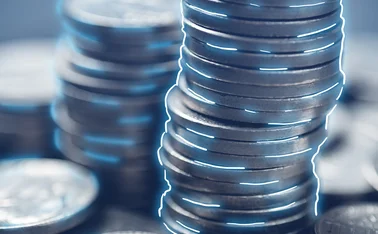 Stack of coins with neon lines as a symbol of cryptocurrency.