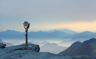 Telescope At Edge Of Cliff Looking Out At Dramatic Landscape
