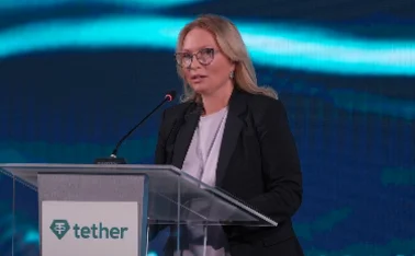 Governor Natia Turnava  of the National Bank of Georgia delivers speech in front of Tether lecturn
