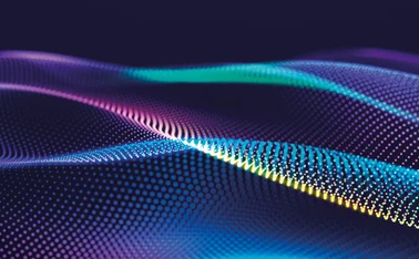 An abstract wave pattern of coloured dots