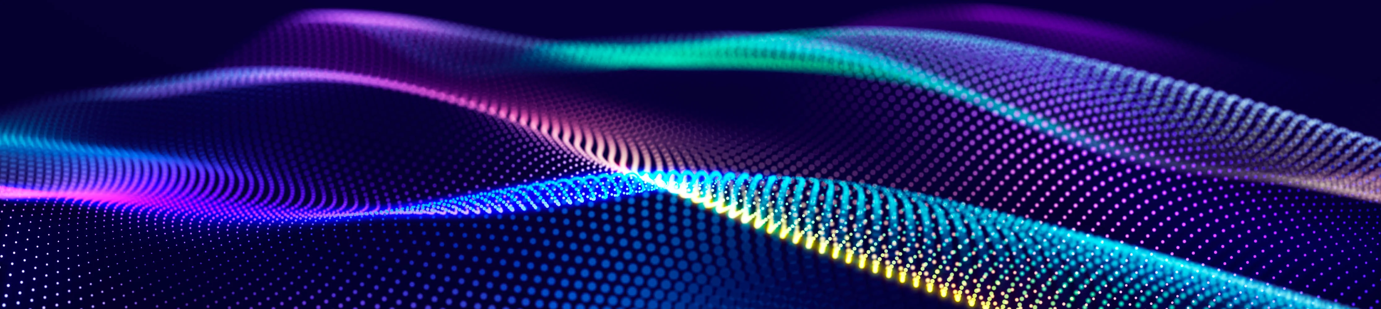 An abstract wave pattern of coloured dots