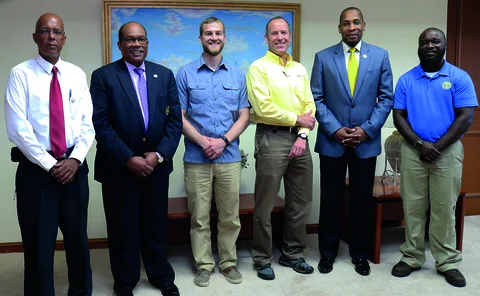 L to R: Wayne Myers and Trevor Brathwaite (ECCB); Daniel Stroth and Marc Lopata (Azimuth); governor Timothy Antoine and Jevon Wilkins (ECCB), May 23, 2018