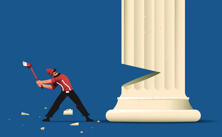 A man chopping at a pillar with an axe