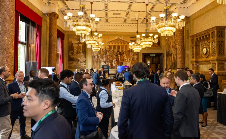 A group of people socialise at the Central Banking London Meetings 2026