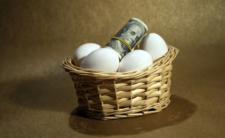 Eggs and dollar notes all in one basket
