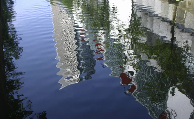 Reflection of buildings in a canal in the Netherlands