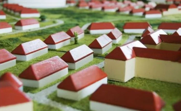 toy-model-village-red-and-white-houses-on-green