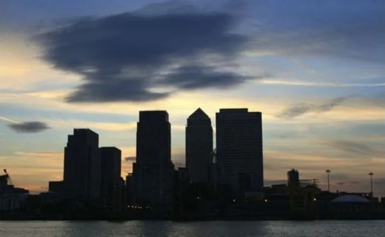 city-of-london-silhouette-under-dark-ominous-cloud