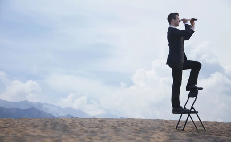 shu-158330657-businessman-telescope-beach