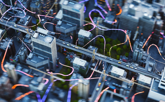 An aerial view of city buildings with bright curved lines connecting them