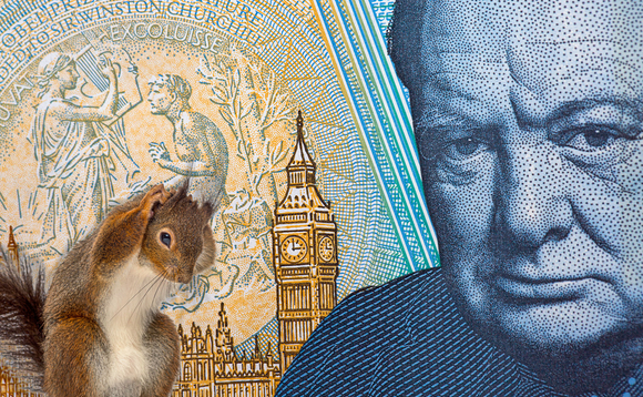A squirrel is seen scratching its head with a backdrop of a 5 pound note