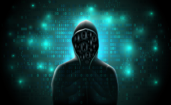 Silhouette of a hacker in a hoodie made up of binary code