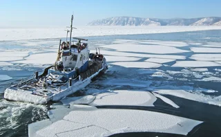 Departing ship among the ice floes on lake Baikal in Listvyanka