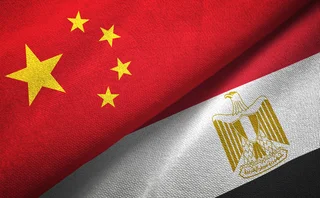 The Egyptian and Chinese flags merge, folded over each other