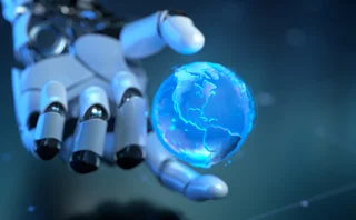 A robotic hand holding a small holographic globe