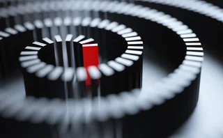 Dominoes arrayed in ever increasing circle