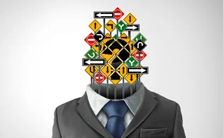 A man with road signs instead of a head. The signs all point in different directions.