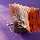 Australian dollars in a vice